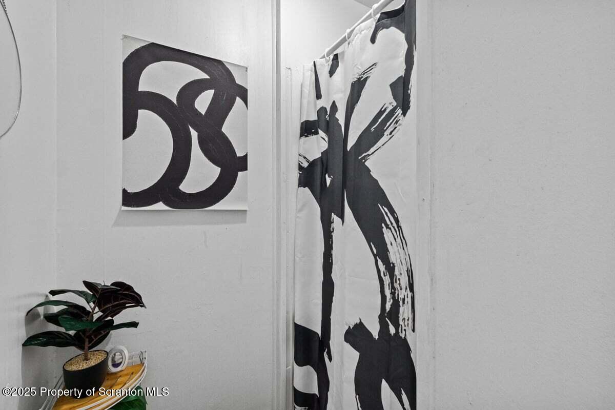 120 Ridgeway Street East Stroudsburg, PA 18301 - Photo 15 of 49 a view of walk in closet with clothes and shoes