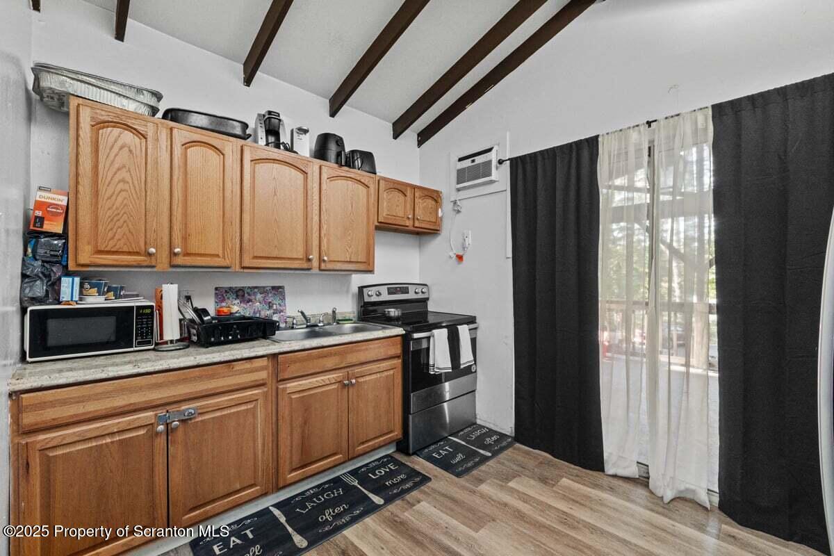 120 Ridgeway Street East Stroudsburg, PA 18301 - Photo 16 of 49 a kitchen with stainless steel appliances a refrigerator and cabinets