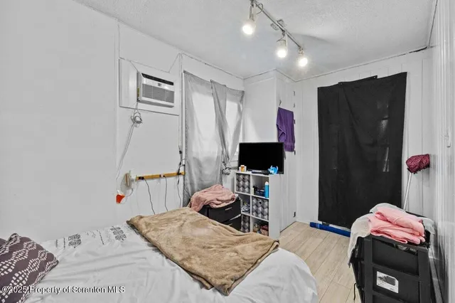 a bedroom with a bed and a closet