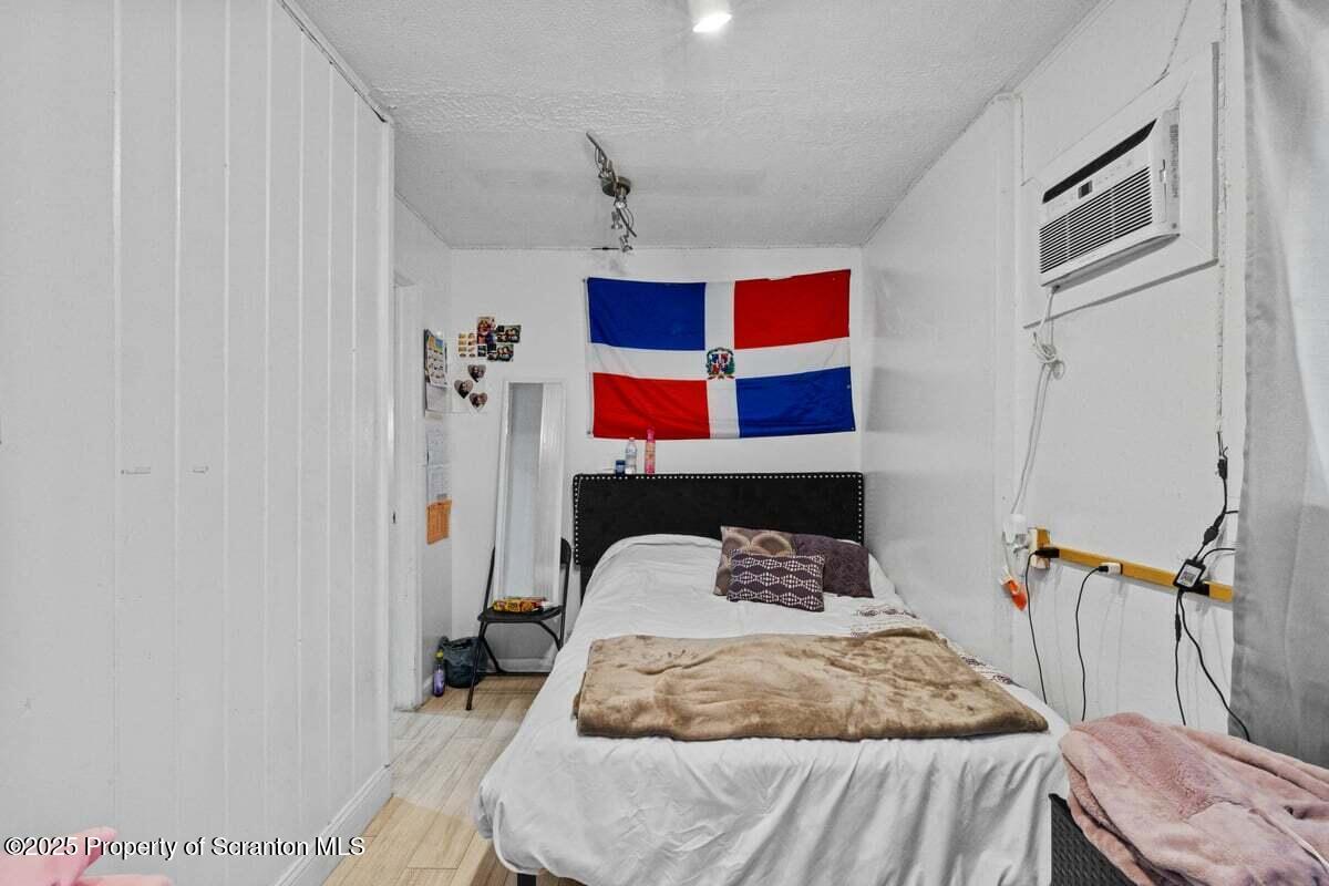 120 Ridgeway Street East Stroudsburg, PA 18301 - Photo 19 of 49 a bedroom with a bed and a cabinets