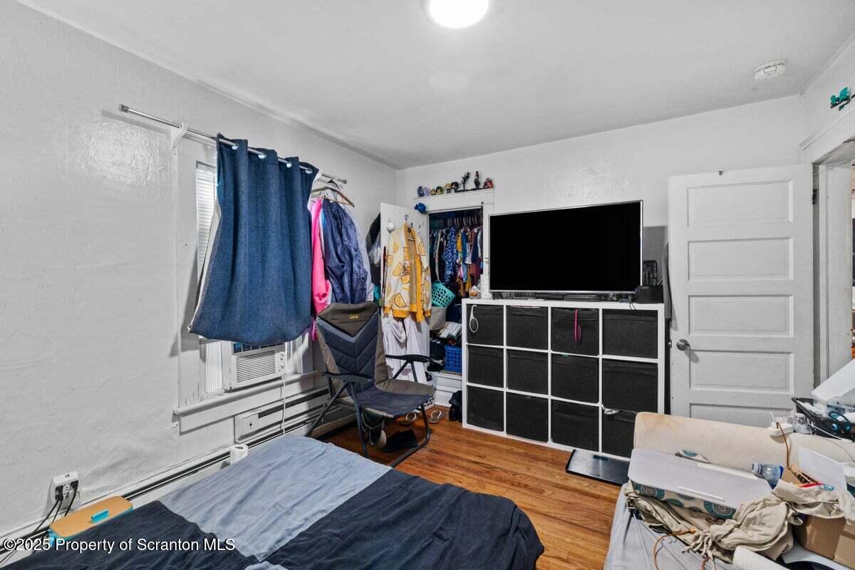120 Ridgeway Street East Stroudsburg, PA 18301 - Photo 36 of 49 a bedroom with furniture and a flat screen tv
