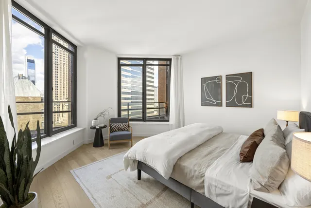 a view of a dining room with furniture and windows