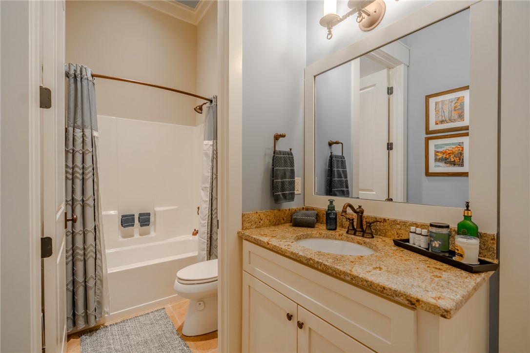 102 State Rd S-39-143 Sunset, SC 29685 - Photo 35 of 47 This bathroom features a sleek vanity and a tub with a shower for everyday convenience.