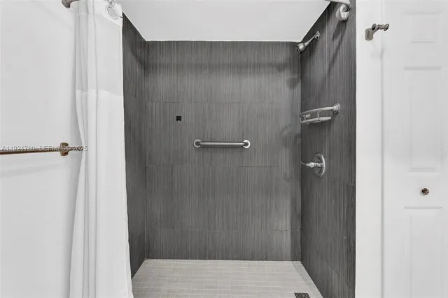 a bathroom with a shower and a toilet