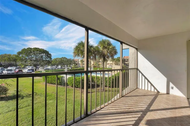 a view of balcony with yard