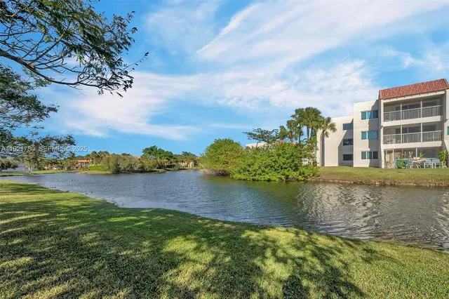 a view of a lake with a house in the background