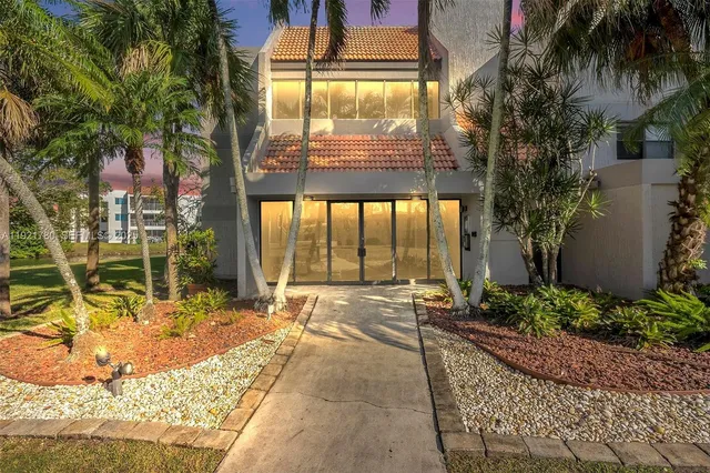 a swimming pool with outdoor seating and yard