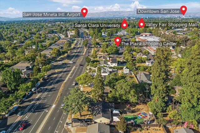 a large tree in front of a house