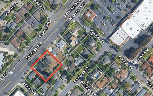 a view of a street with a cars parked on the road