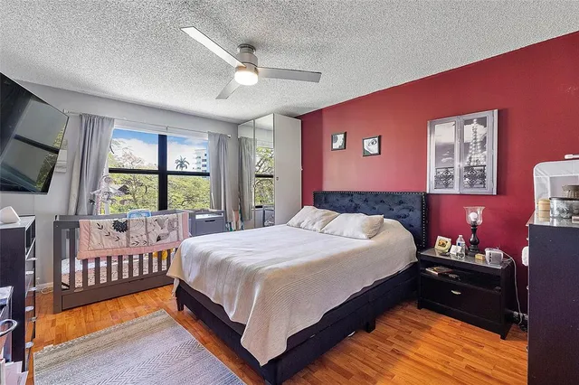 a bed room with a bed and a window