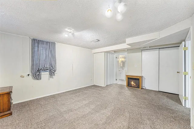 a view of livingroom with a fireplace