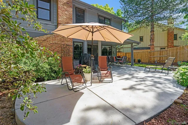 a view of a chair and table in the patio