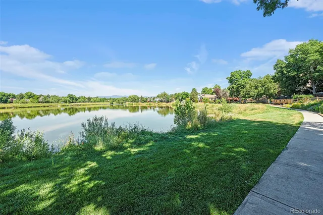a view of a lake with houses in the back