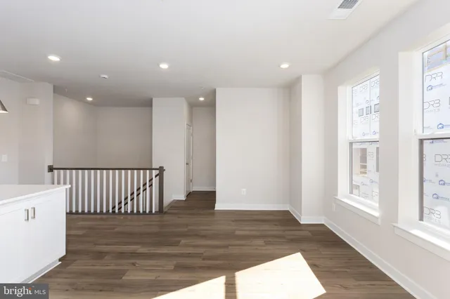 a view of entryway with wooden floor