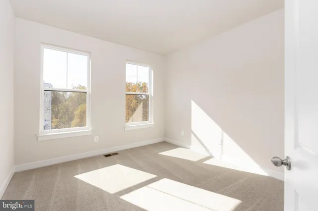 a view of living room with furniture and a window