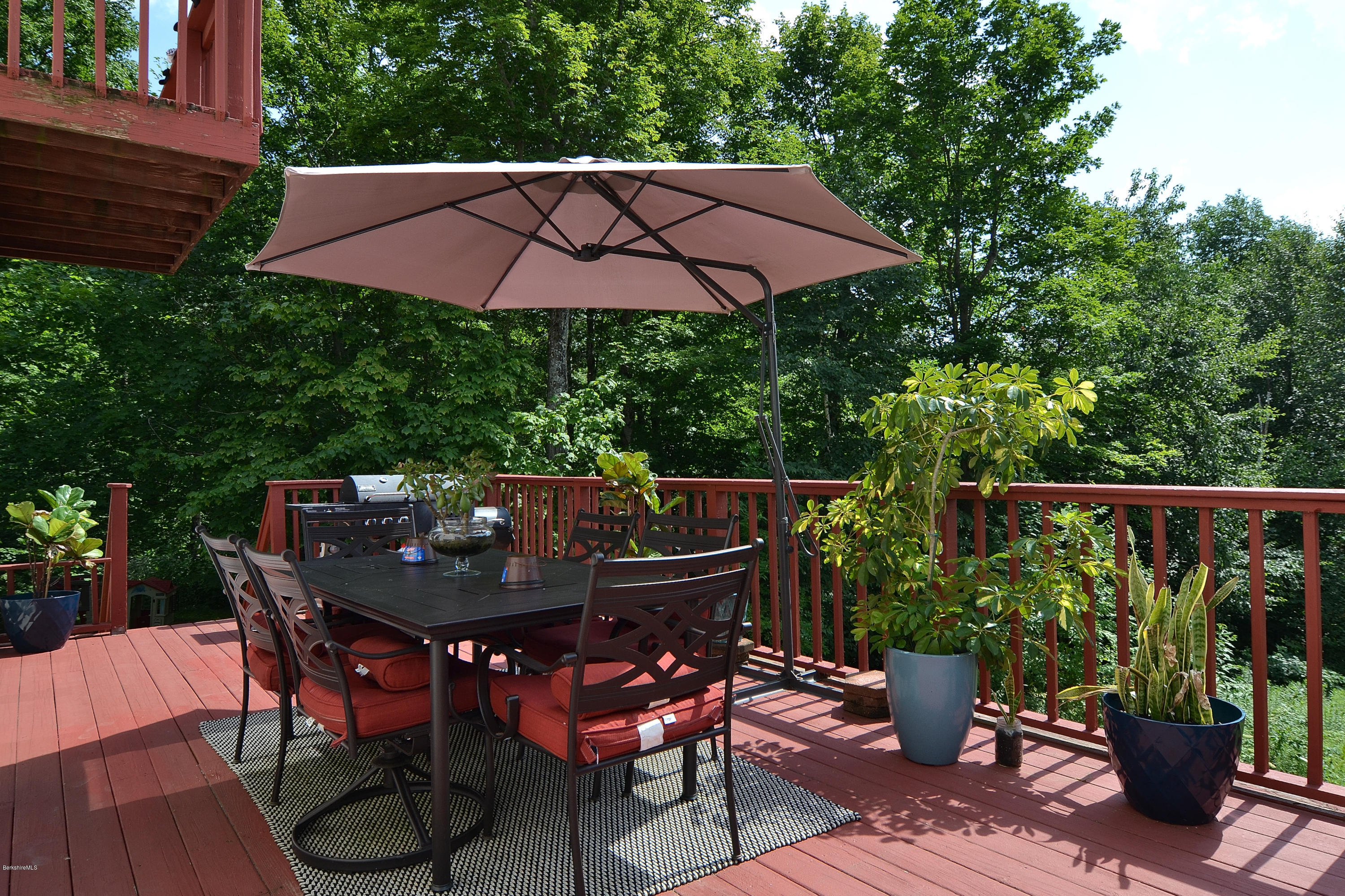 693 George Carter Road Becket, MA 01223 - Photo 14 of 36 a view of an outdoor sitting area with furniture and wooden floor