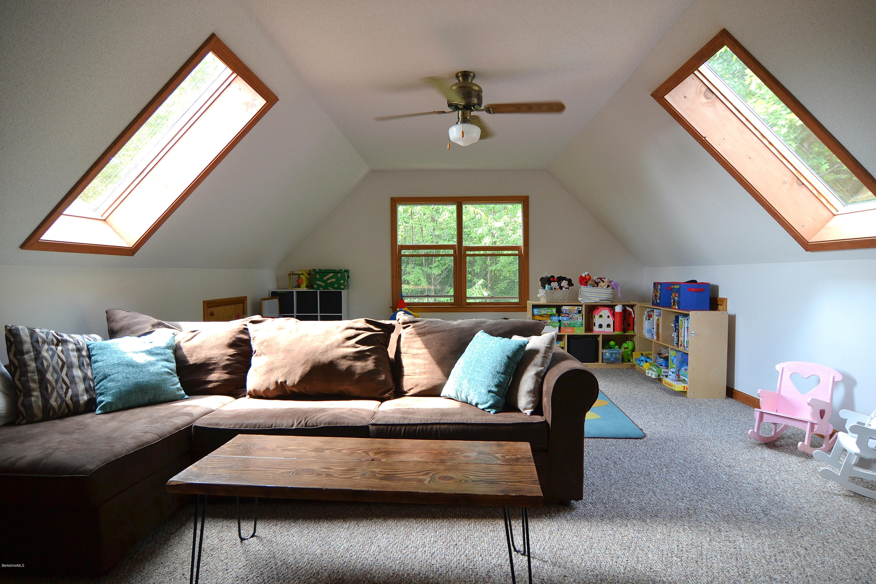 693 George Carter Road Becket, MA 01223 - Photo 17 of 36 a living room with furniture and a window