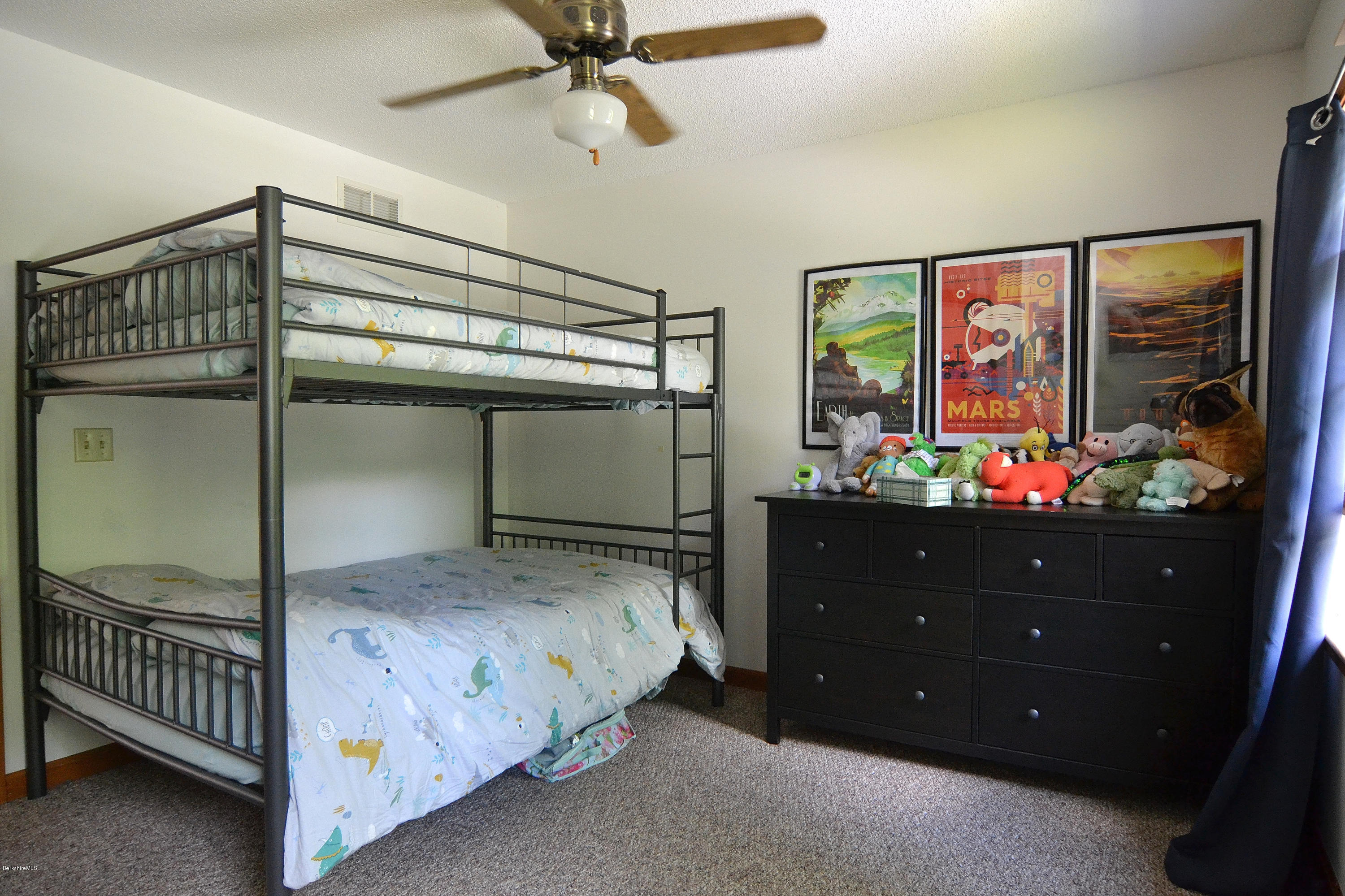 693 George Carter Road Becket, MA 01223 - Photo 20 of 36 a bedroom with a bed and a window