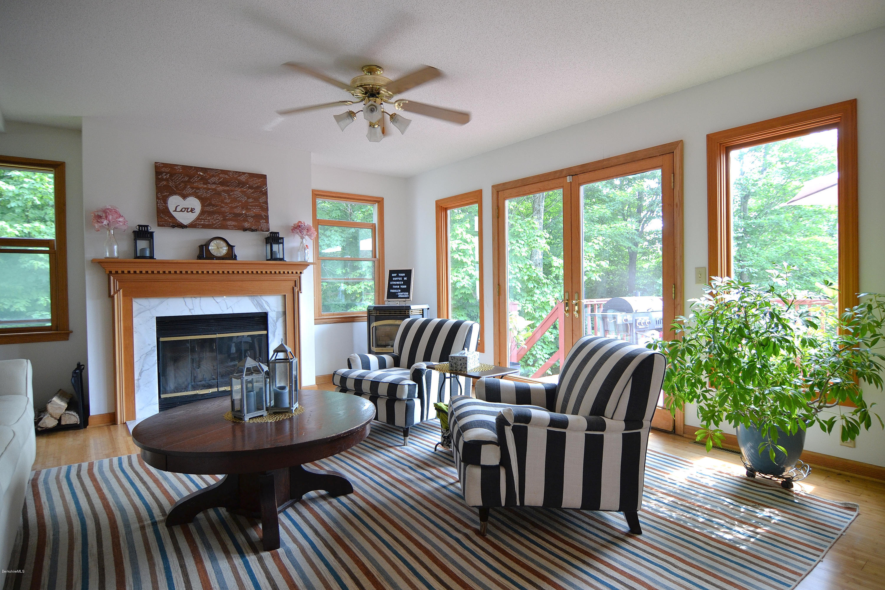 693 George Carter Road Becket, MA 01223 - Photo 3 of 36 a living room with furniture and a fireplace