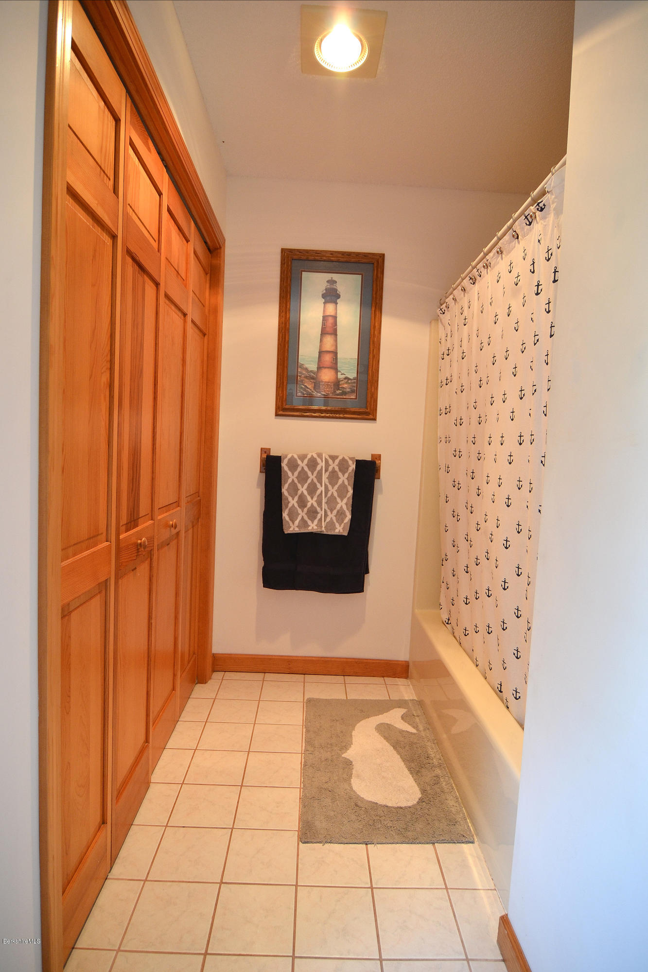693 George Carter Road Becket, MA 01223 - Photo 21 of 36 a view of a hallway with wooden floor and a window