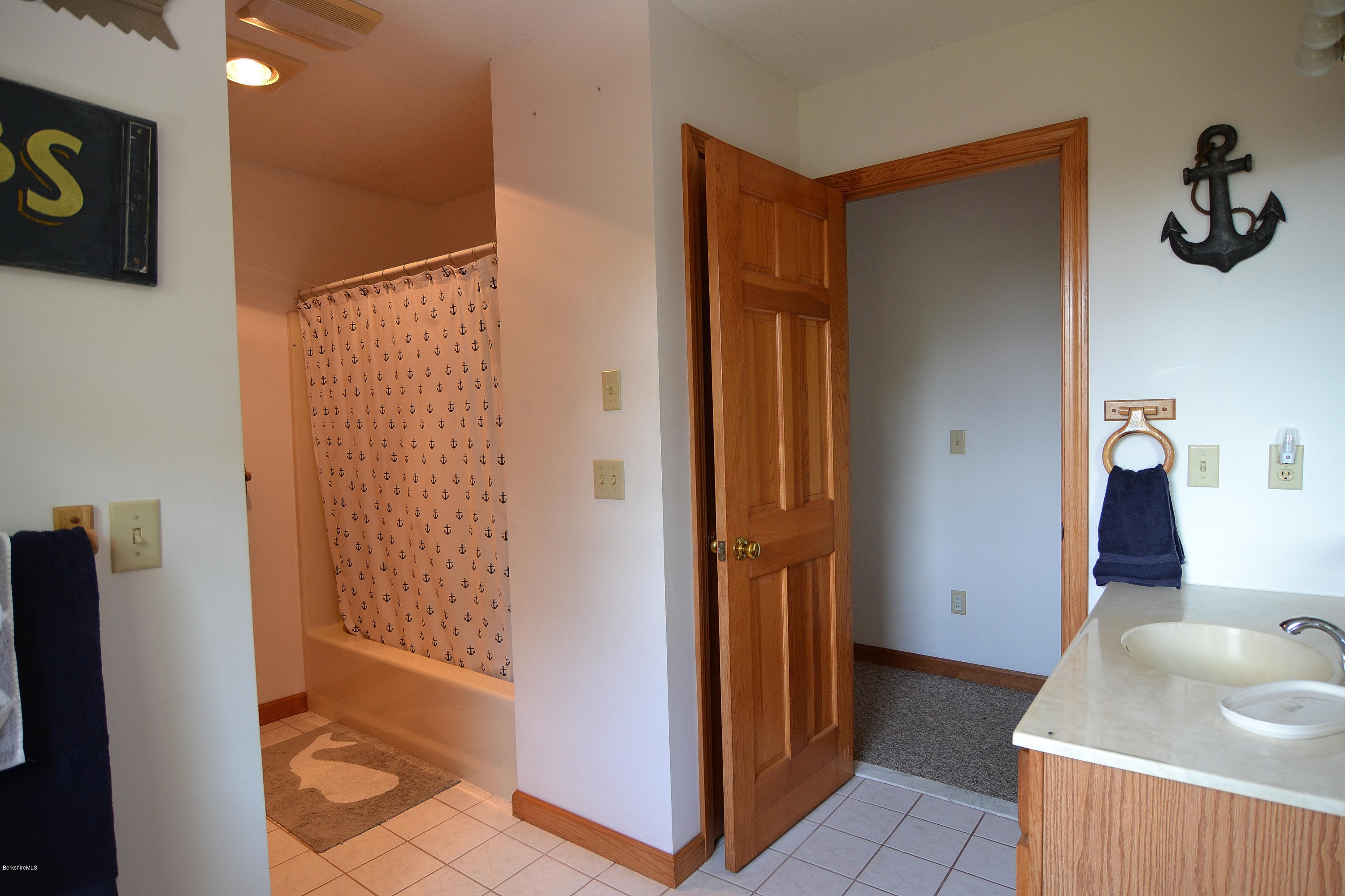693 George Carter Road Becket, MA 01223 - Photo 24 of 36 a bathroom with a sink and a shower