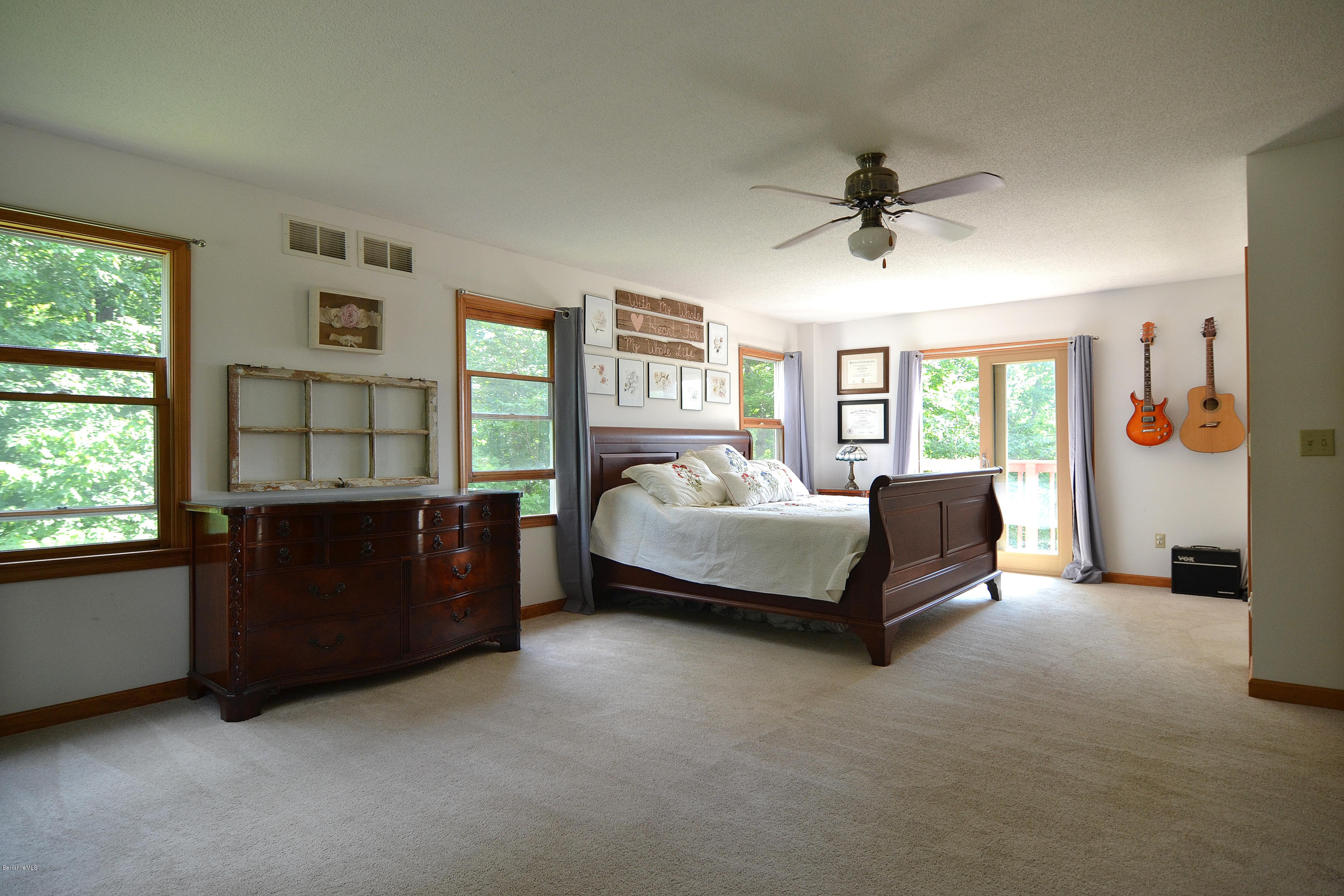 693 George Carter Road Becket, MA 01223 - Photo 25 of 36 a bedroom with a bed and a window