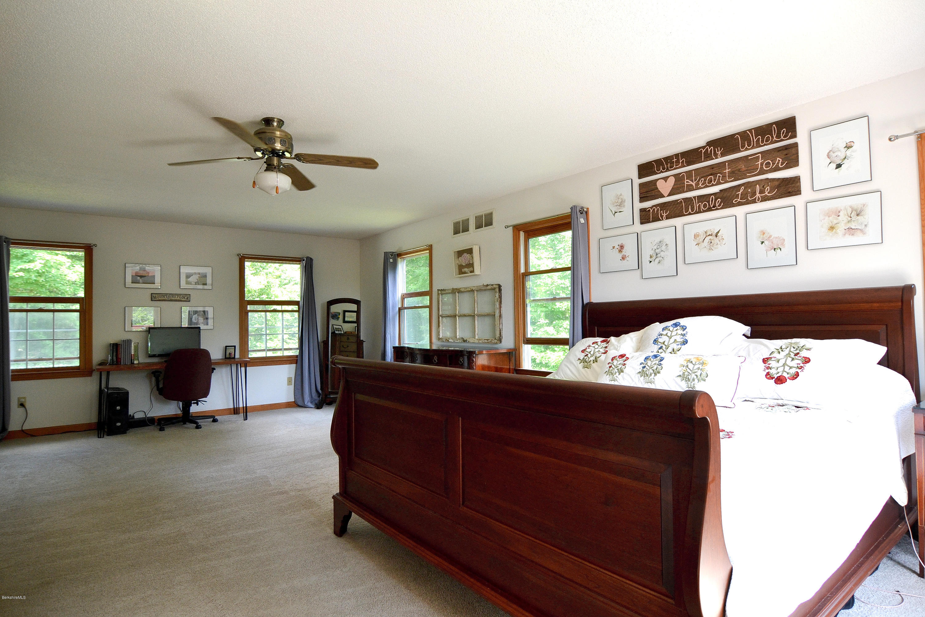 693 George Carter Road Becket, MA 01223 - Photo 26 of 36 a bed room with a bed window and dresser
