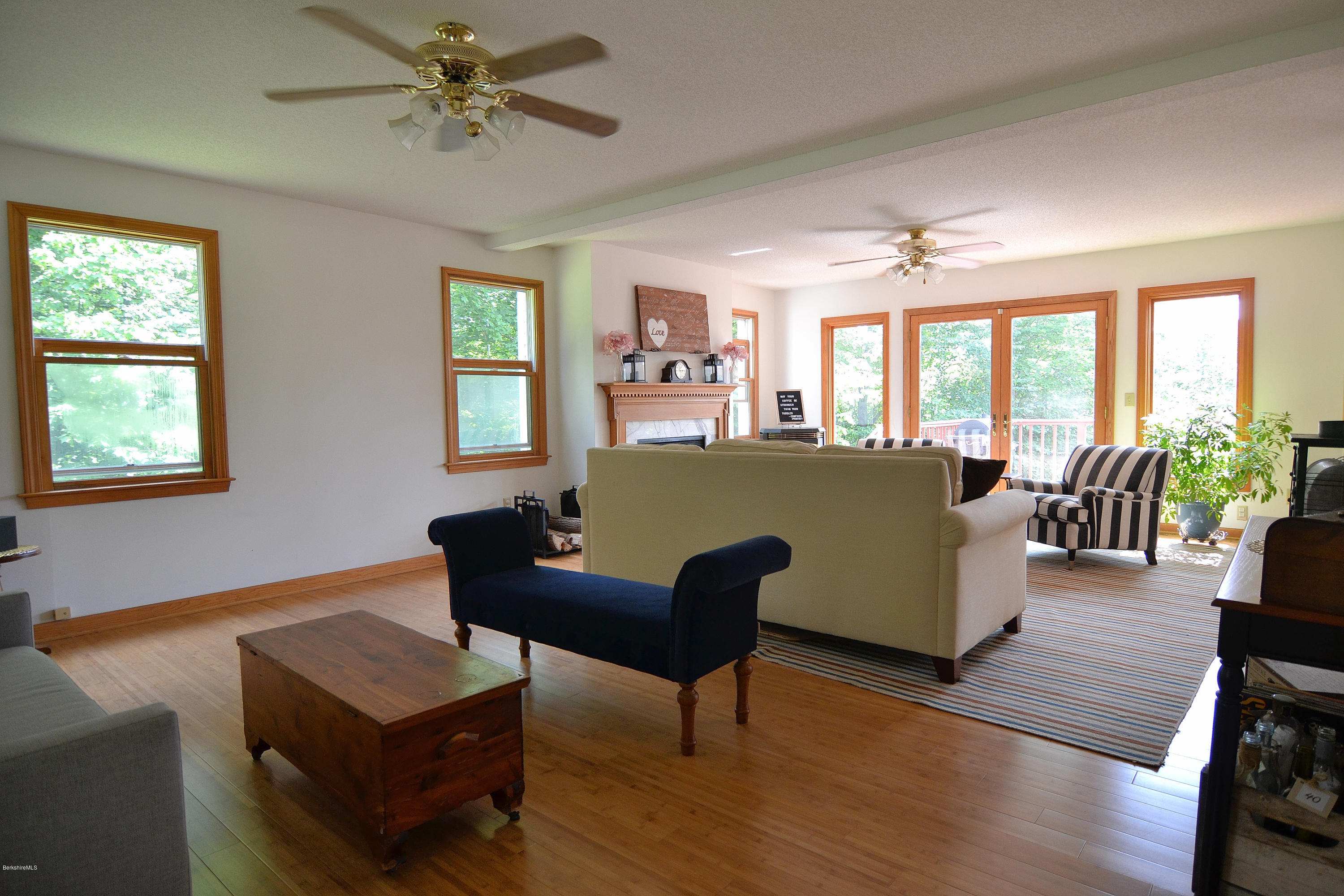 693 George Carter Road Becket, MA 01223 - Photo 4 of 36 a living room with furniture and a large window