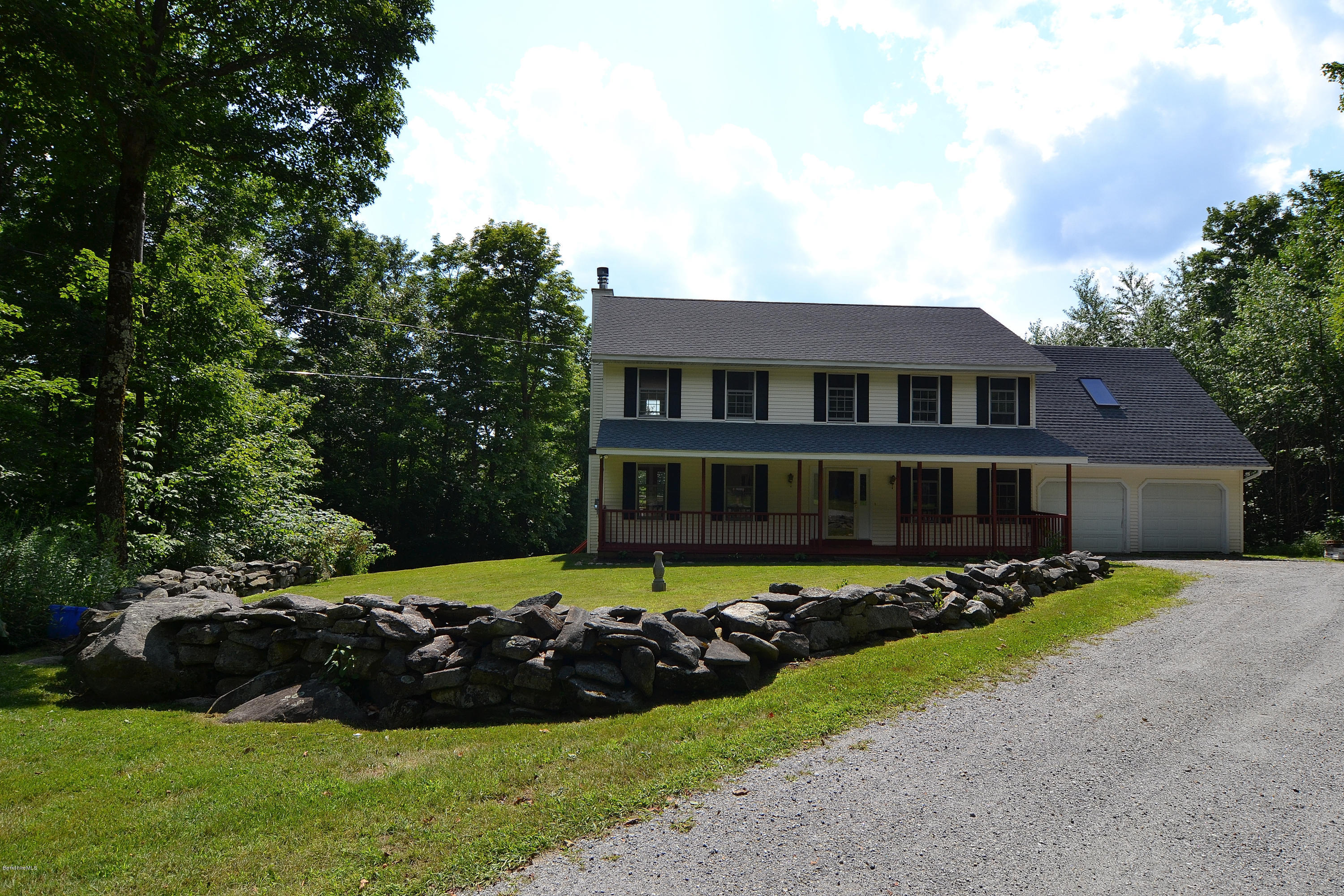 693 George Carter Road Becket, MA 01223 - Photo 31 of 36 a view of a house with a garden