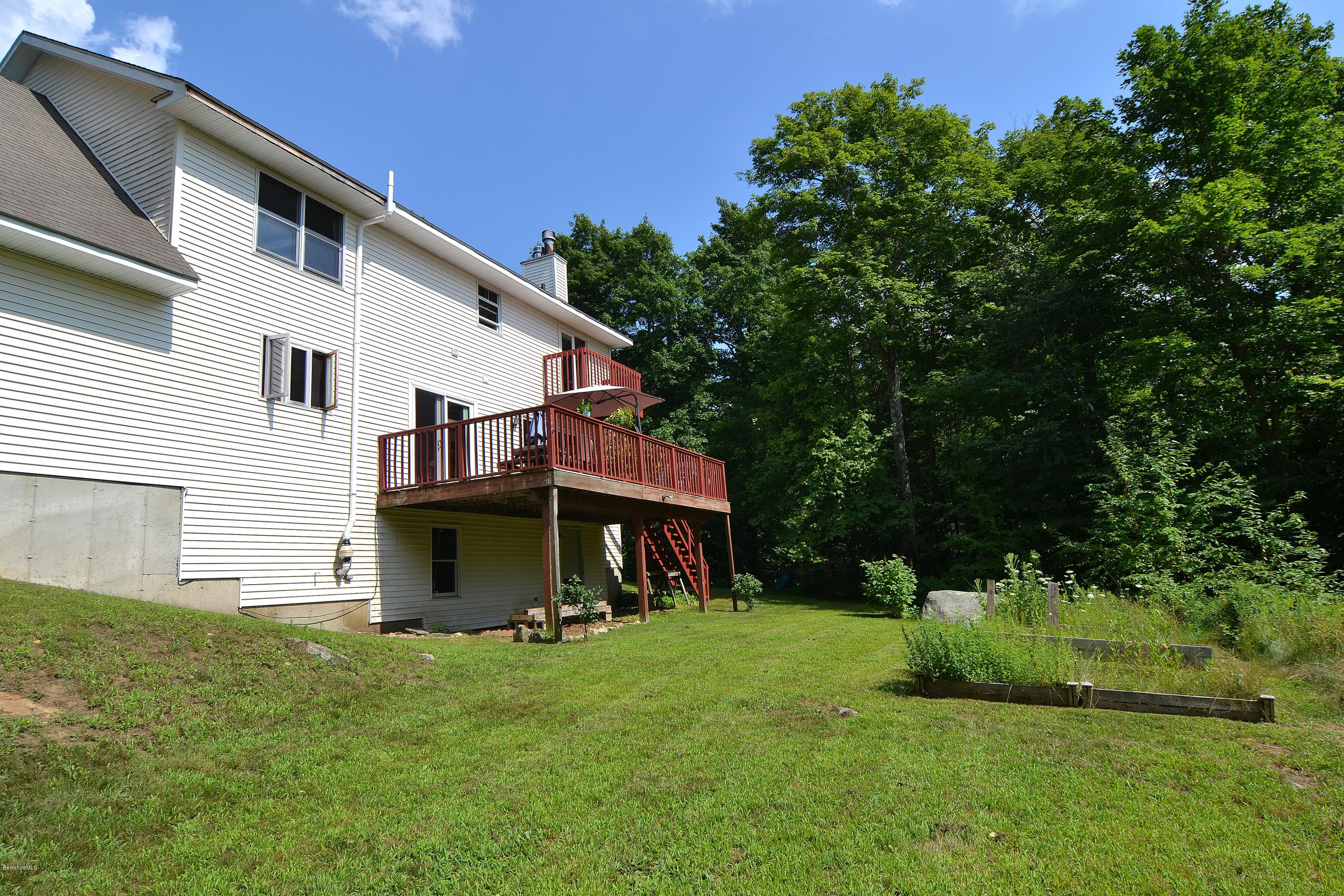 693 George Carter Road Becket, MA 01223 - Photo 34 of 36 a view of a yard in front of house