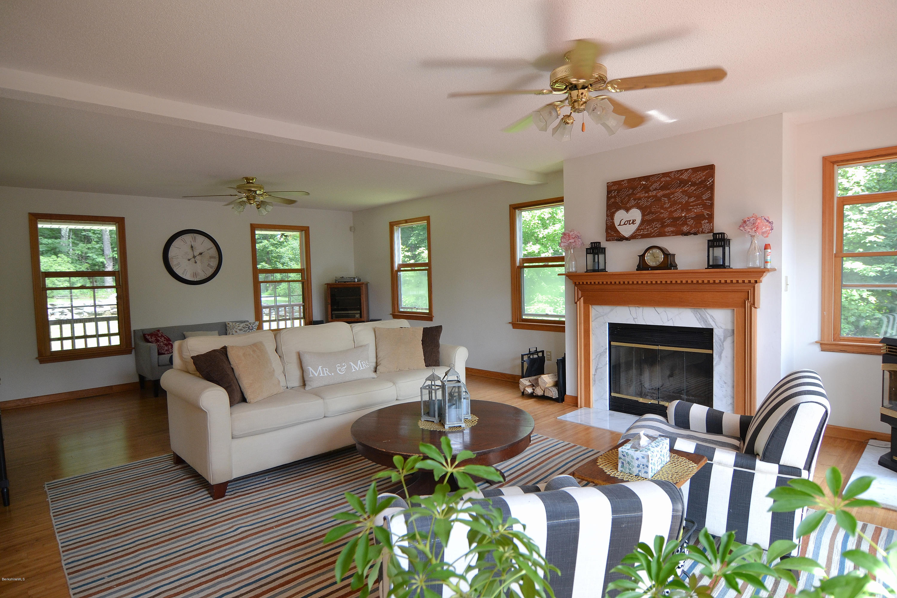 693 George Carter Road Becket, MA 01223 - Photo 6 of 36 a living room with furniture and a fireplace