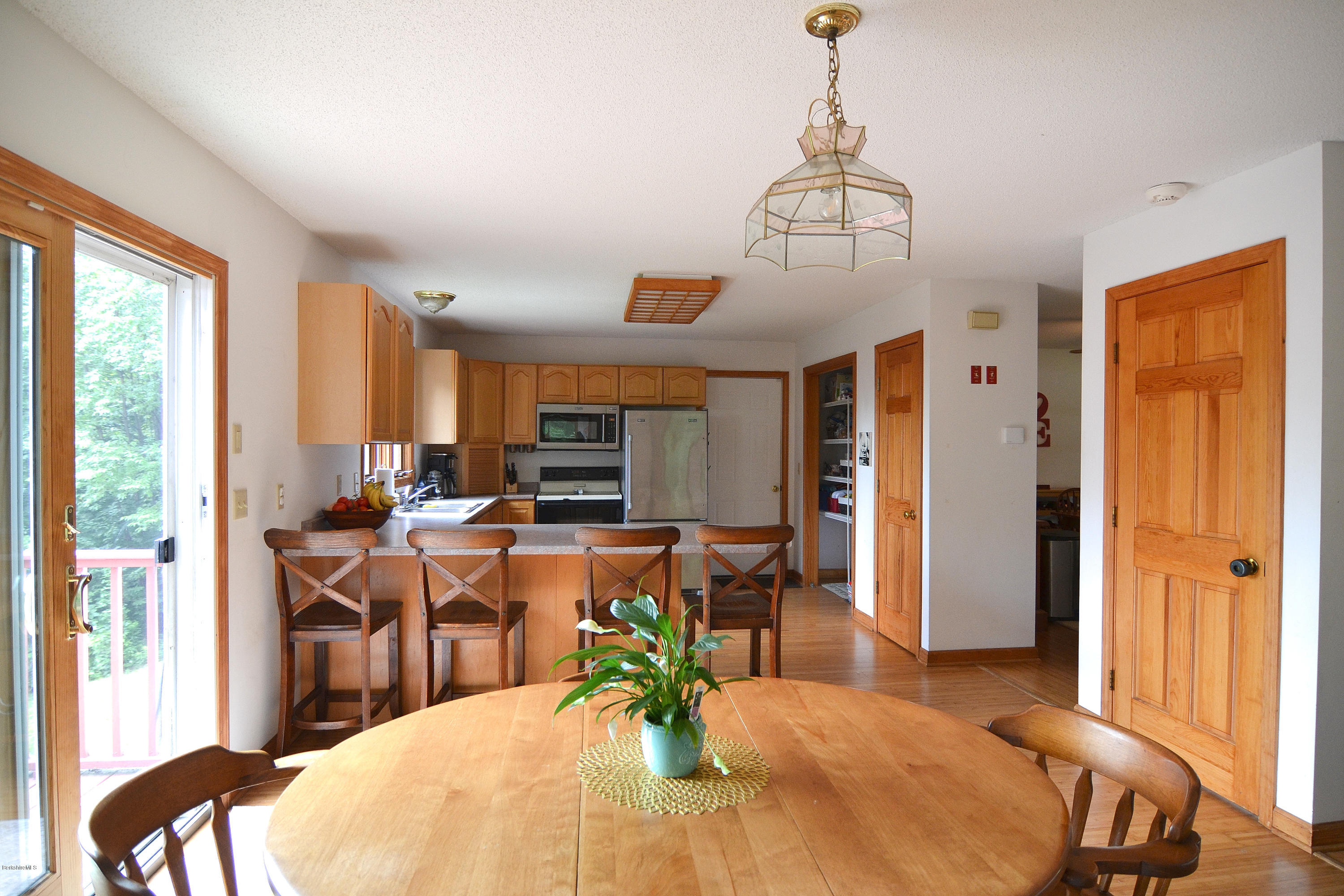 693 George Carter Road Becket, MA 01223 - Photo 7 of 36 a view of a dining room with furniture window and outside view