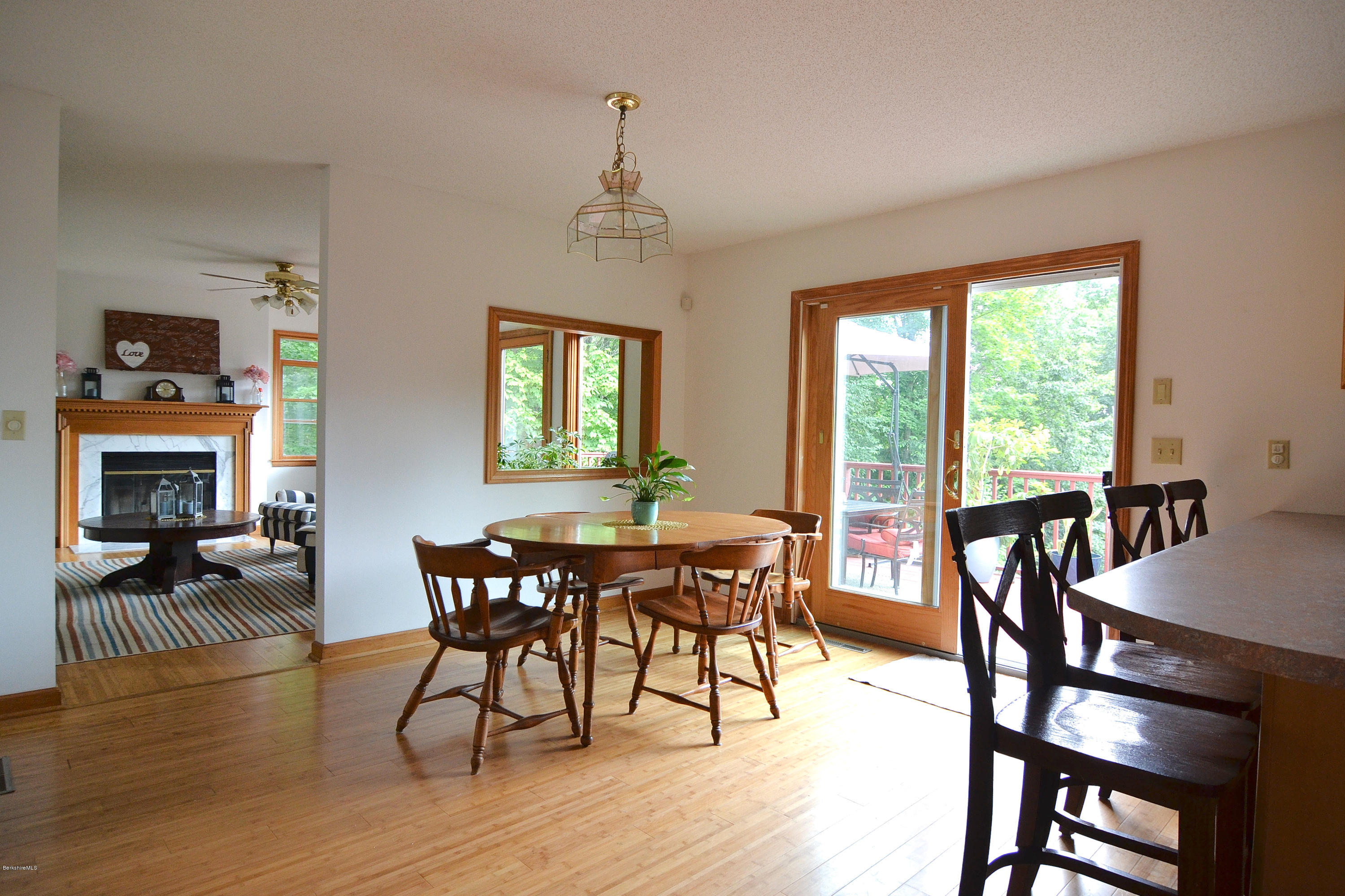 693 George Carter Road Becket, MA 01223 - Photo 8 of 36 a view of a dining room with furniture window and wooden floor