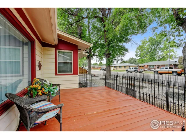 a view of backyard with a garden and seating area