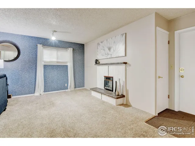 a view of a livingroom with a fireplace