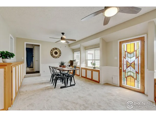 a view of a livingroom with furniture window and wooden floor