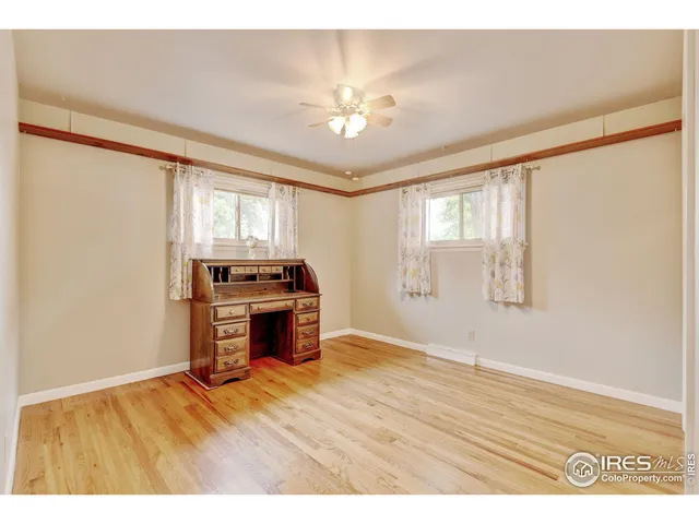 a view of kitchen with granite countertop cabinets and wooden floor