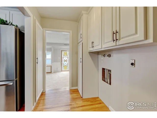 a view of a kitchen from the hallway