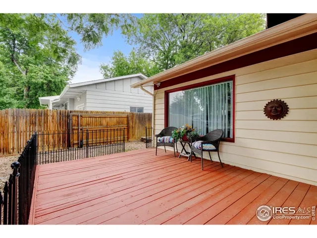 a view of a deck with wooden floor and seating space