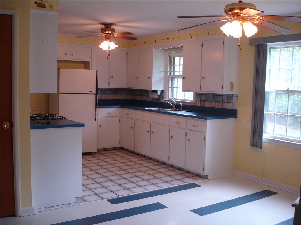 66 Halsey Road Woonsocket, RI 02895 - Photo 3 of 19 Spacious workable kitchen with adjacent dining area.