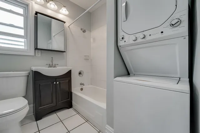 a bathroom with a sink a toilet and bathtub