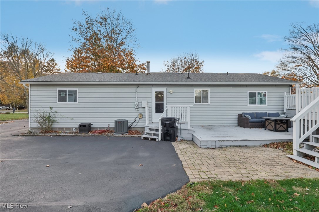 167 Birch Road Painesville, OH 44077 - Photo 39 of 49 Back of property featuring central AC and a patio area