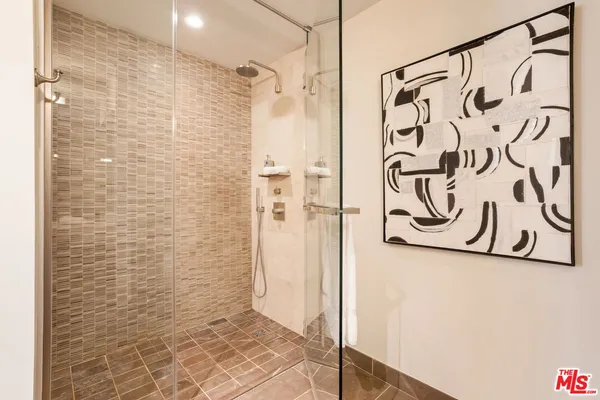 a bathroom with a shower and a shower curtain