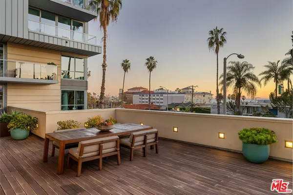 a view of a terrace with furniture and a table