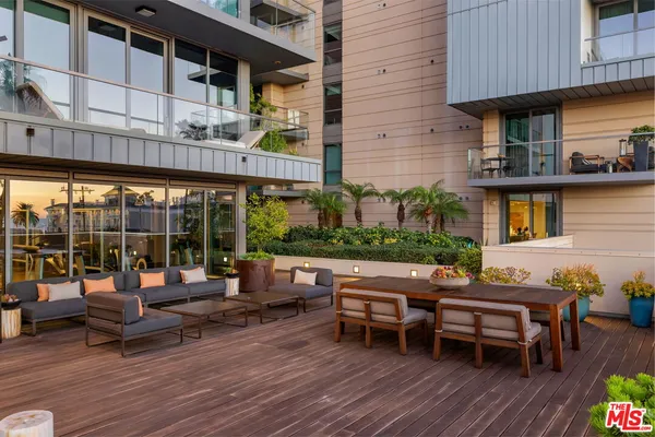 a backyard of a house with outdoor seating