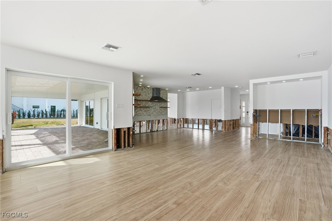 380 Conners Avenue Naples, FL 34108 - Photo 13 of 49 a view of kitchen with furniture and wooden floor