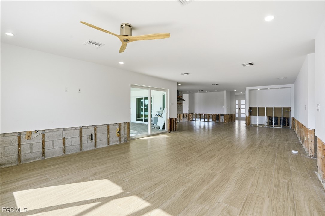 380 Conners Avenue Naples, FL 34108 - Photo 14 of 49 a view of livingroom with hardwood floor and a ceiling fan