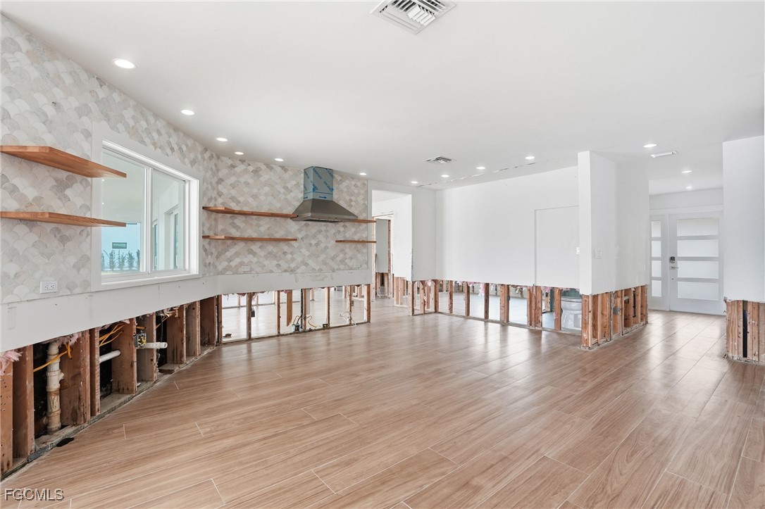 380 Conners Avenue Naples, FL 34108 - Photo 15 of 49 a view of dining room with wooden floor