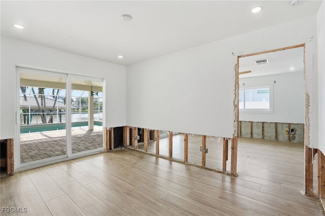 380 Conners Avenue Naples, FL 34108 - Photo 17 of 49 a view of an entryway with wooden floor