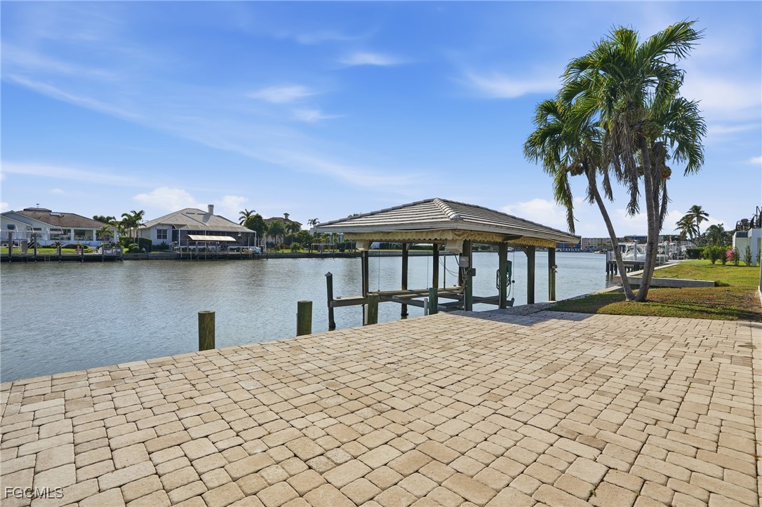 380 Conners Avenue Naples, FL 34108 - Photo 2 of 49 a house with view of lake